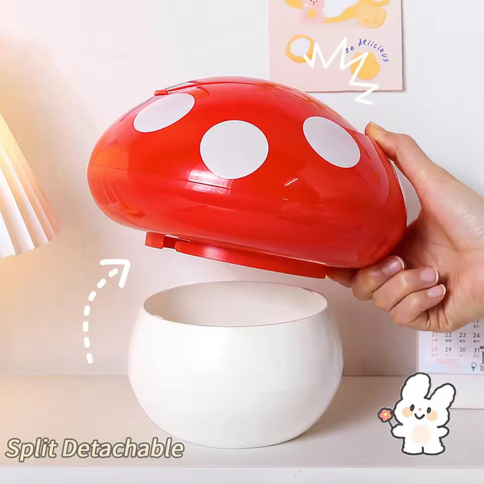 Red mushroom-shaped lid being held over a white container with a hand holding it.