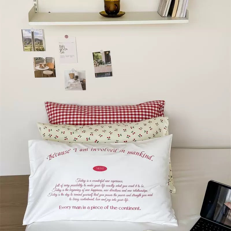 Aesthetic cherry cotton pillowcase styled in a soft girl bedroom with pastel decor.