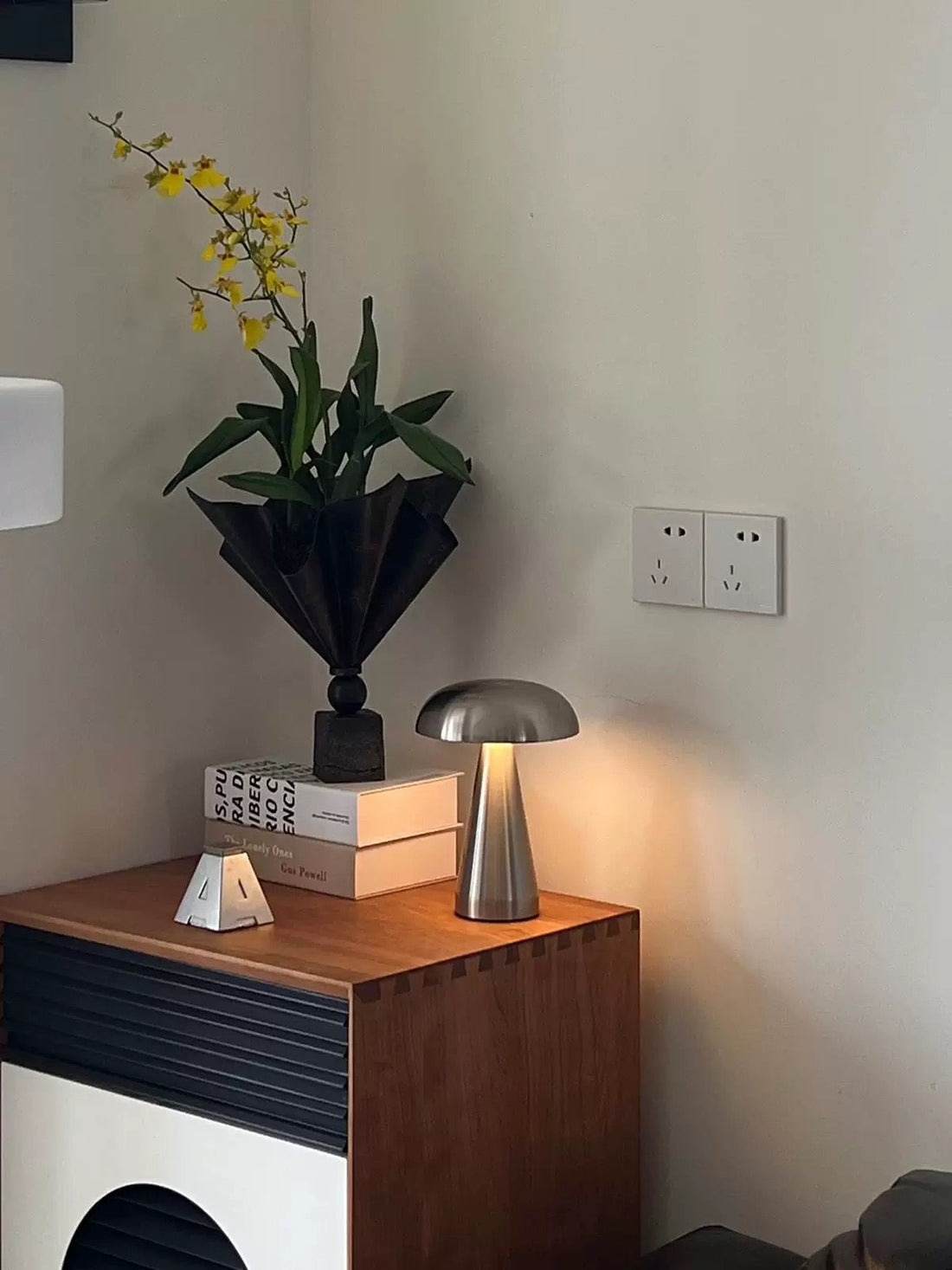 Silver Scandinavian LED lamp with touch control glowing softly