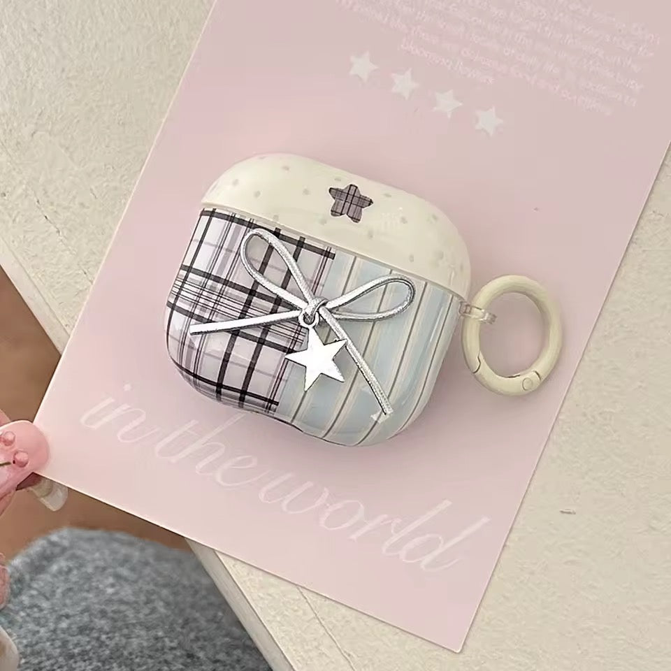 Plaid patterned case with star design on a pink background