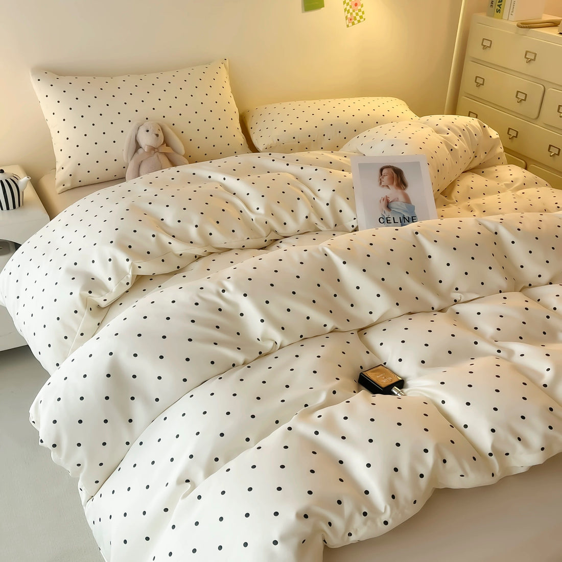 Summer satin duvet cover set with playful black dot polka design.