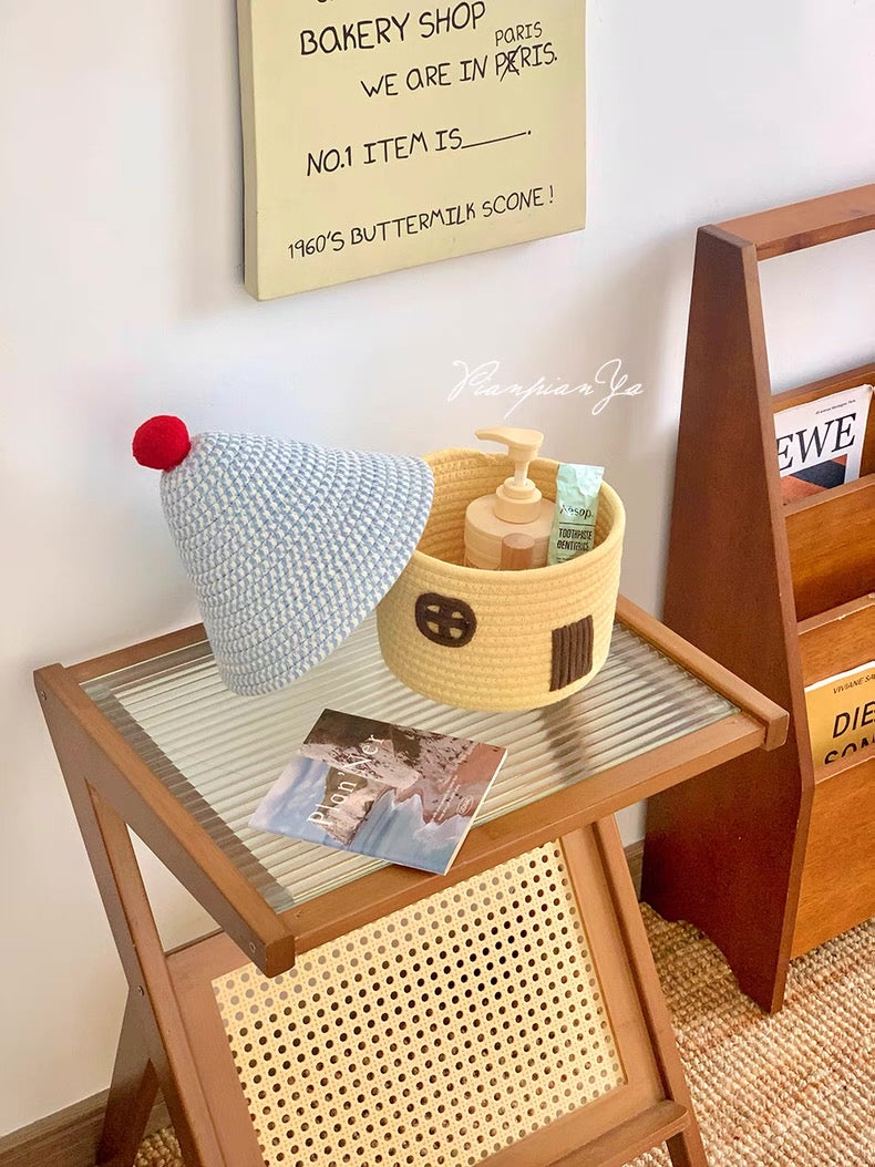 Playful storage bin styled for a cozy pastel-themed desk setup