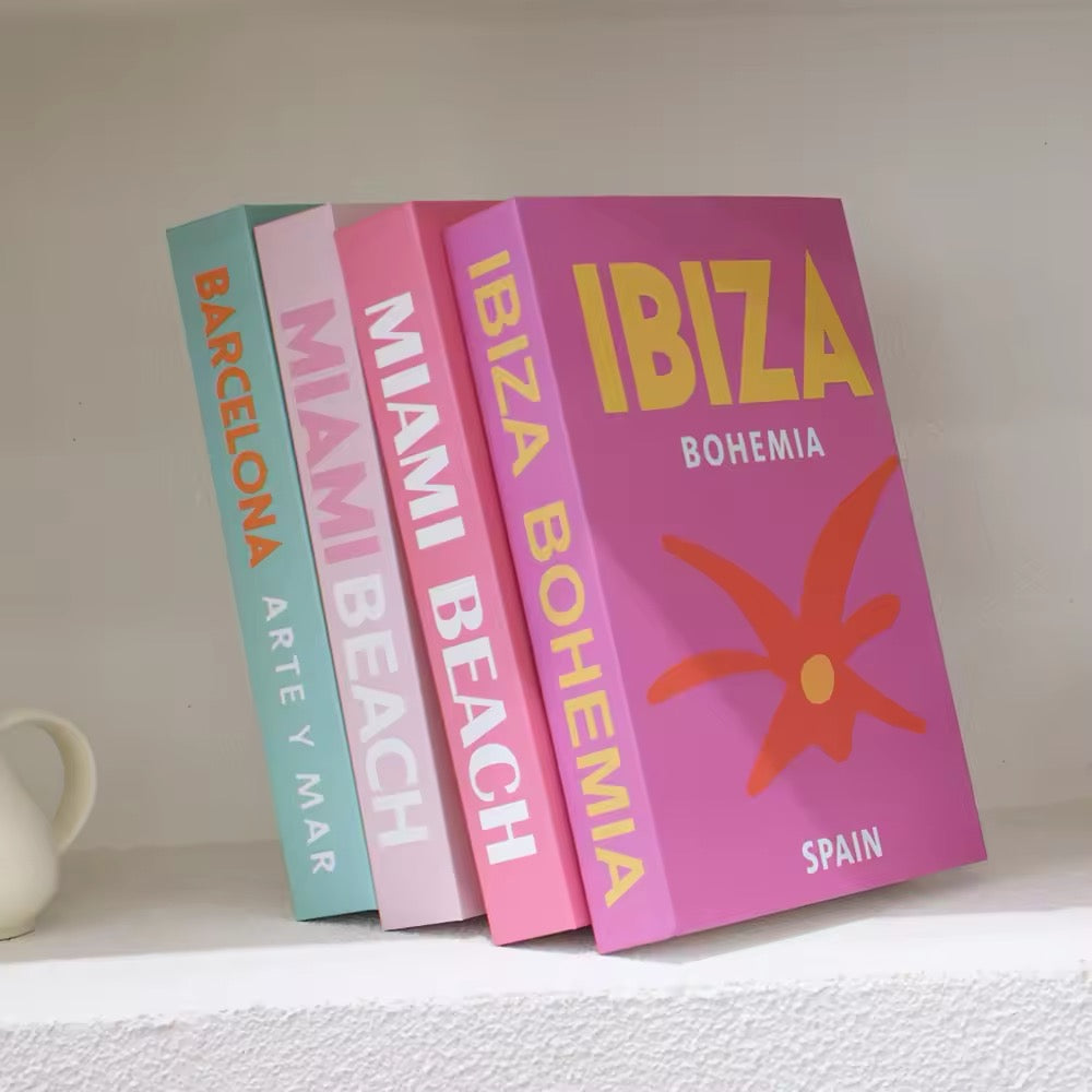 Decorative book spines in pastel tones neatly displayed on a shelf next to minimalist ceramic decor