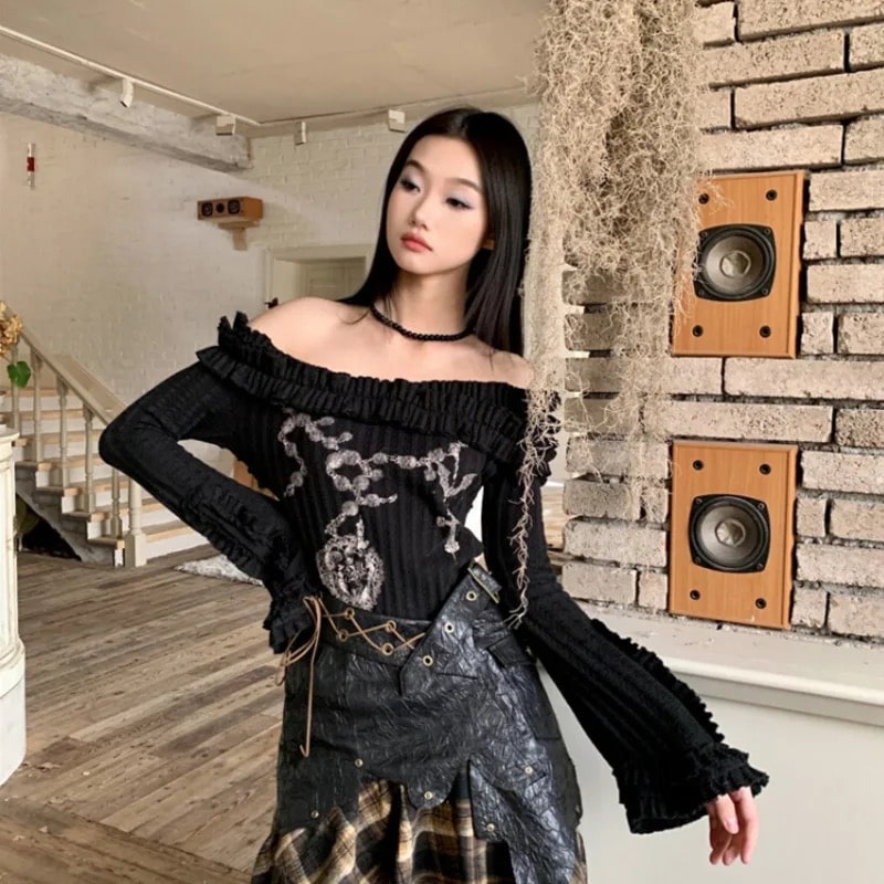 Y2K grunge sweater with off-shoulder slash neck and flare sleeves. Gothic knitted crop top for women’s vintage aesthetic fashion.