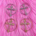 Punk aesthetic gold cross earrings with crystal hoops. Y2K-inspired jewelry for bold fashion statements.