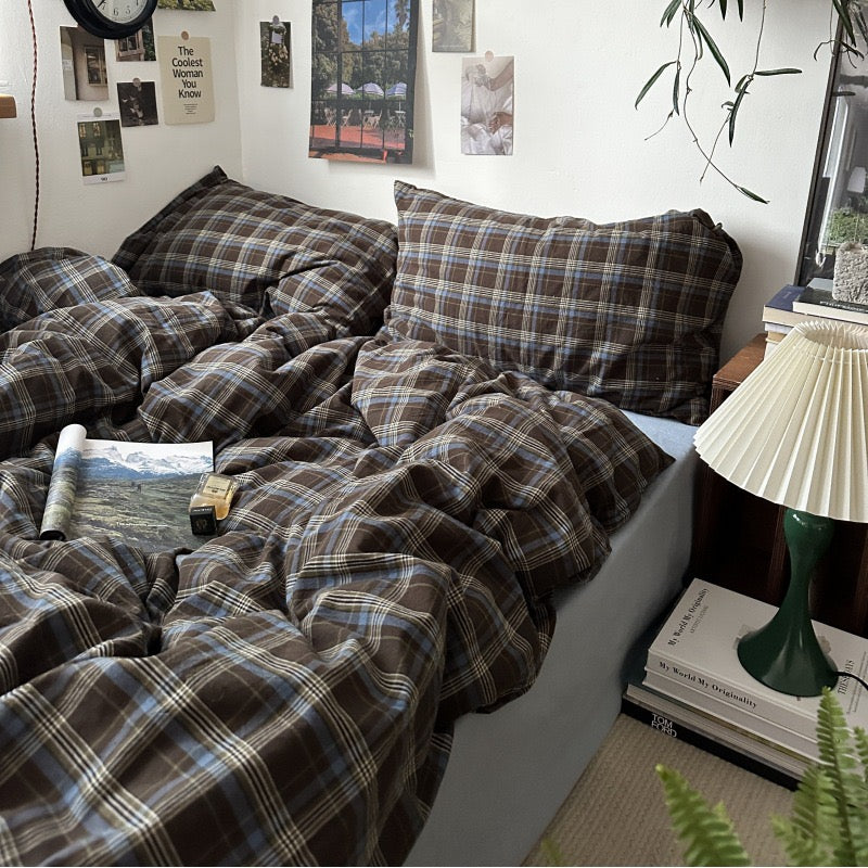 Blue and brown plaid bedding with matching plaid pillowcases