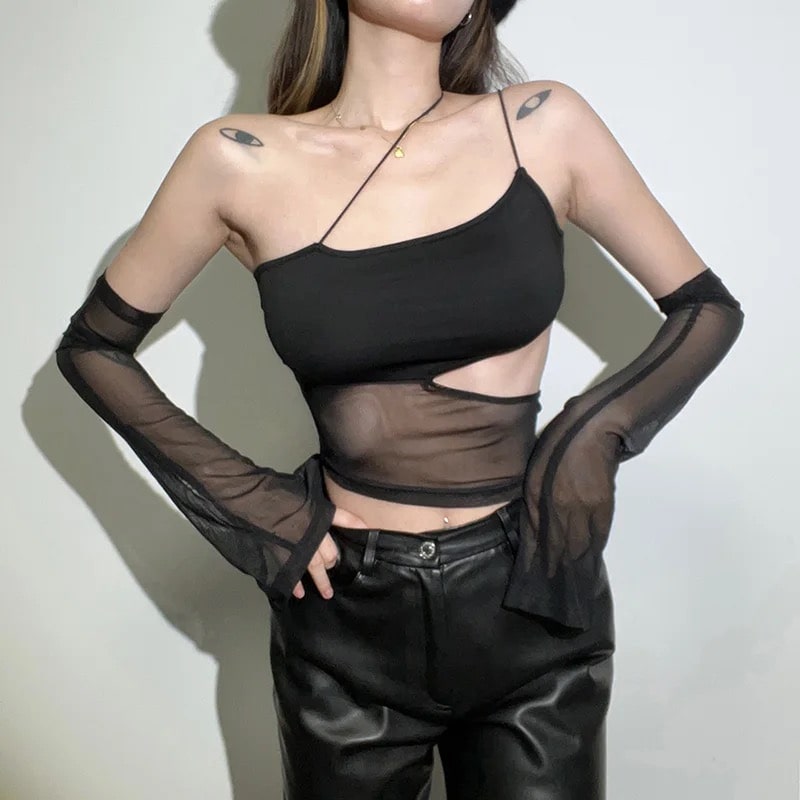 Image of a girl wearing a gothic crop top, showcasing dark and edgy style.
