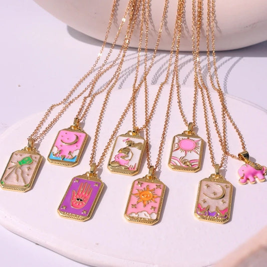 Pink tarot card necklace with intricate detailing, perfect for mystical enthusiasts.
