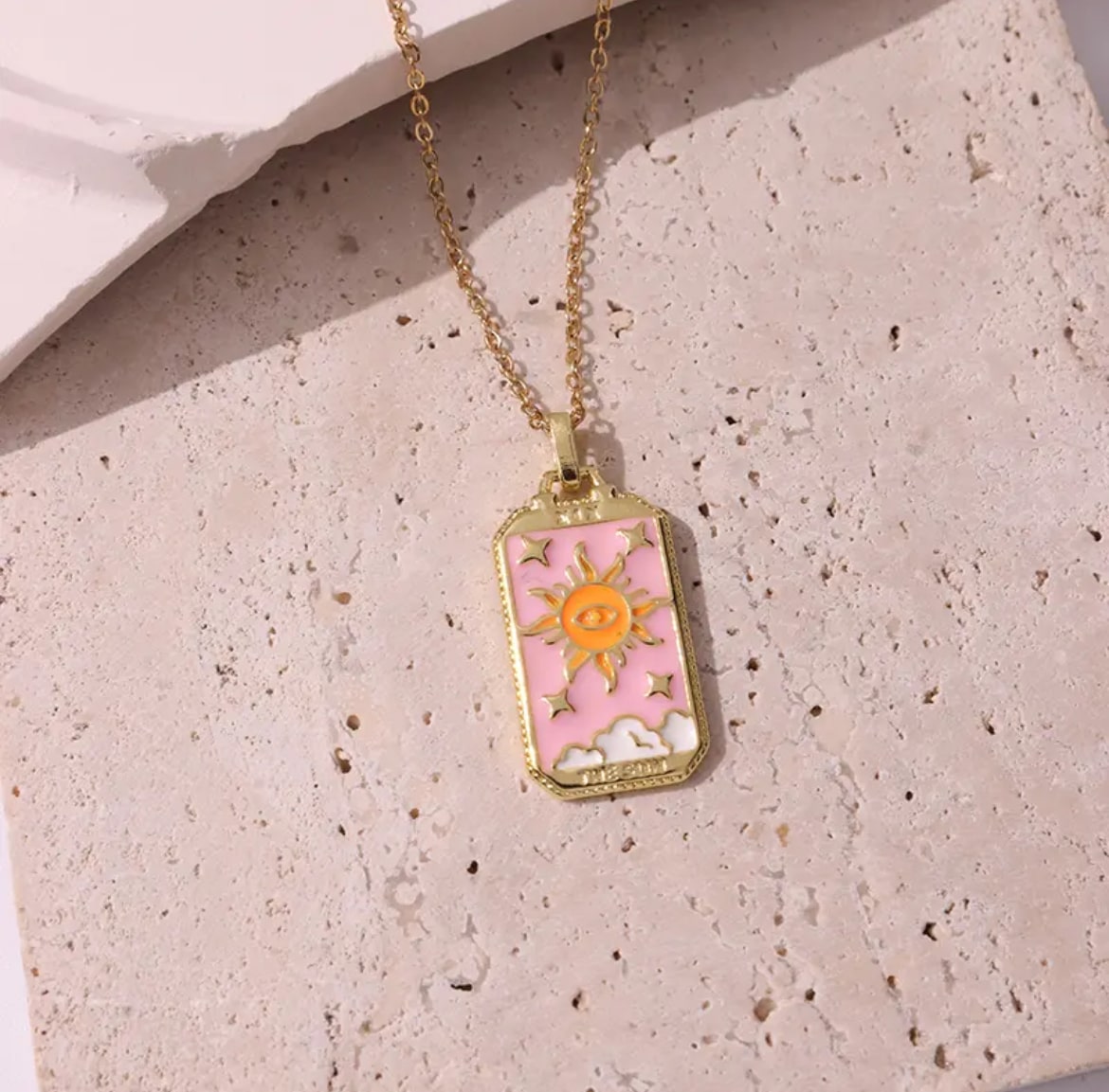 Enchanting pink tarot card jewelry, adding a mystical vibe to your look.