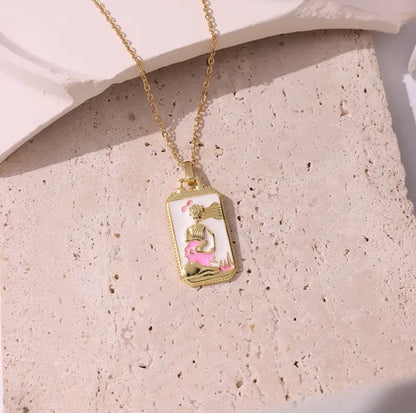 Dainty pink tarot card necklace, a beautiful reminder of the mystical world.