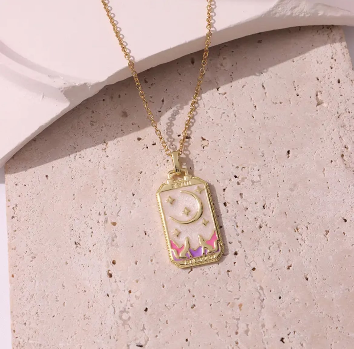 Elegant pink tarot card charm necklace, perfect for spiritual seekers.