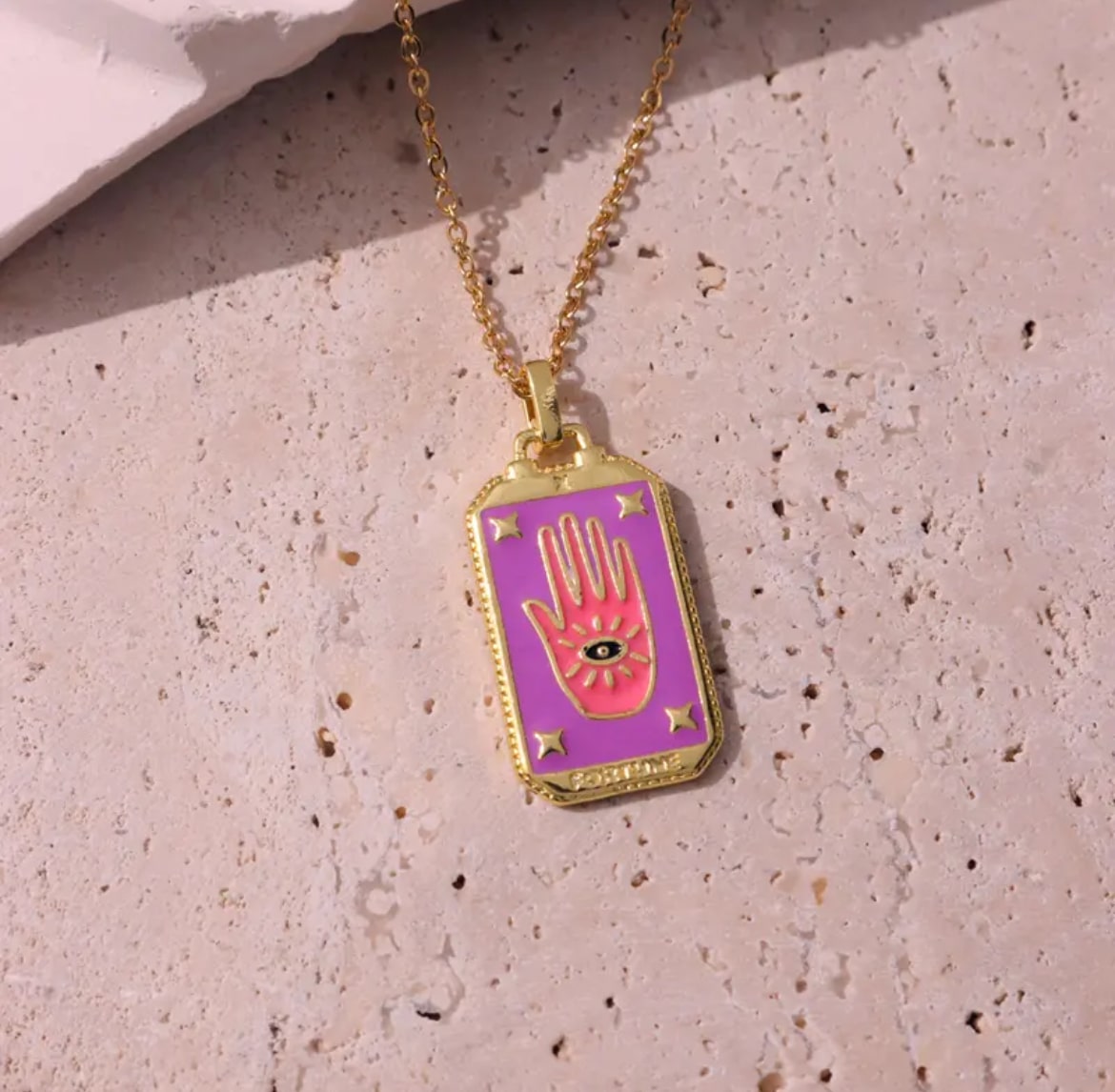 Pink tarot card necklace, a unique and meaningful accessory for any occasion.