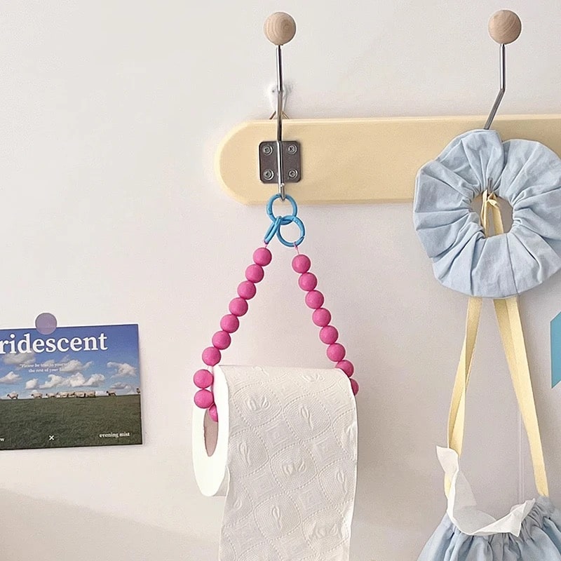 Pink hanging beaded tissue holder, a stylish addition to your bathroom decor.