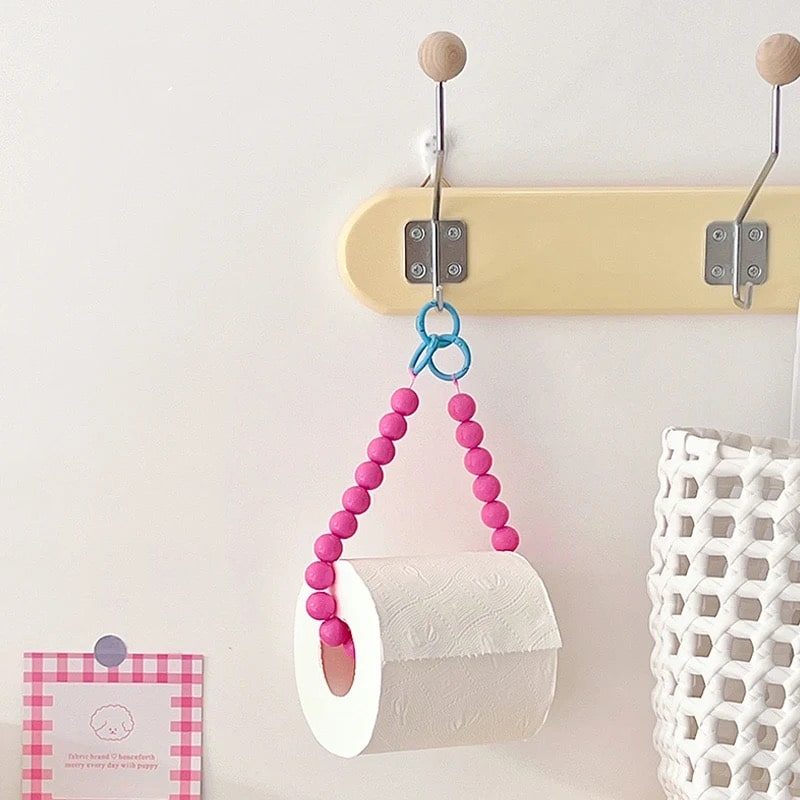 Pink hanging beaded tissue holder, a stylish addition to your bathroom decor.