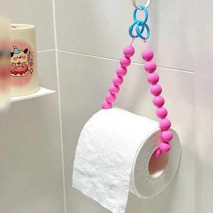 Beaded pink tissue holder, adding a pop of color and texture to your bathroom.