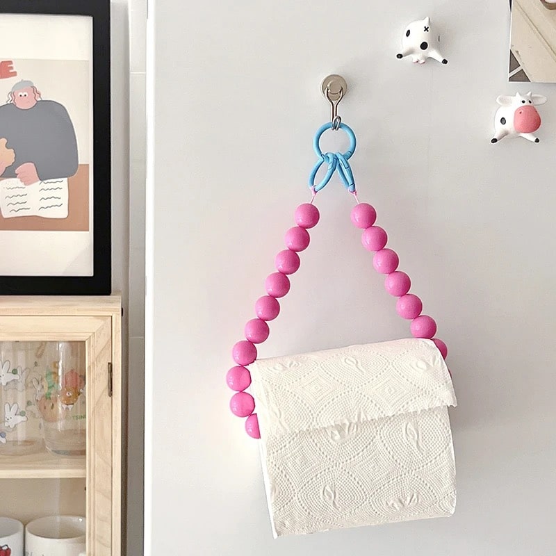 Pink hanging tissue holder with intricate beadwork, enhancing your Y2K decor.