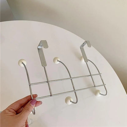Practical wall hanger organizer with hooks, ideal for maximizing vertical storage space.
