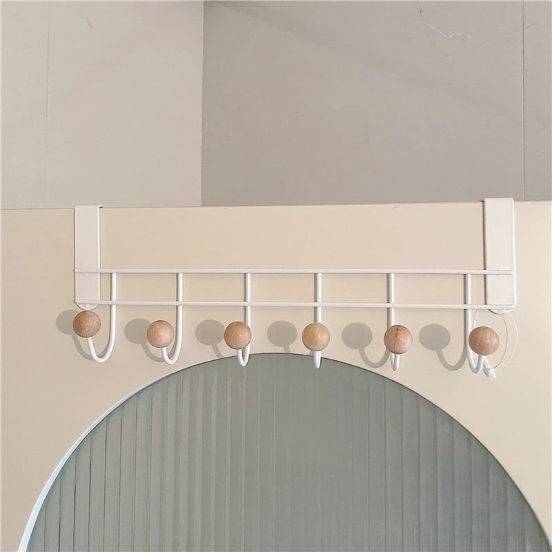 Nordic decor-inspired wall hanger organizer with a retro twist, ideal for entryways.