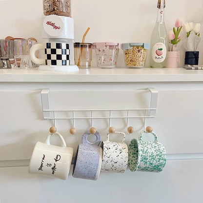 Image of a back hook wall hanger organizer, featuring multiple hooks for hanging coats and bags.