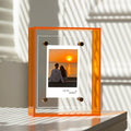 Transparent acrylic photo frame used in modern bathroom decor