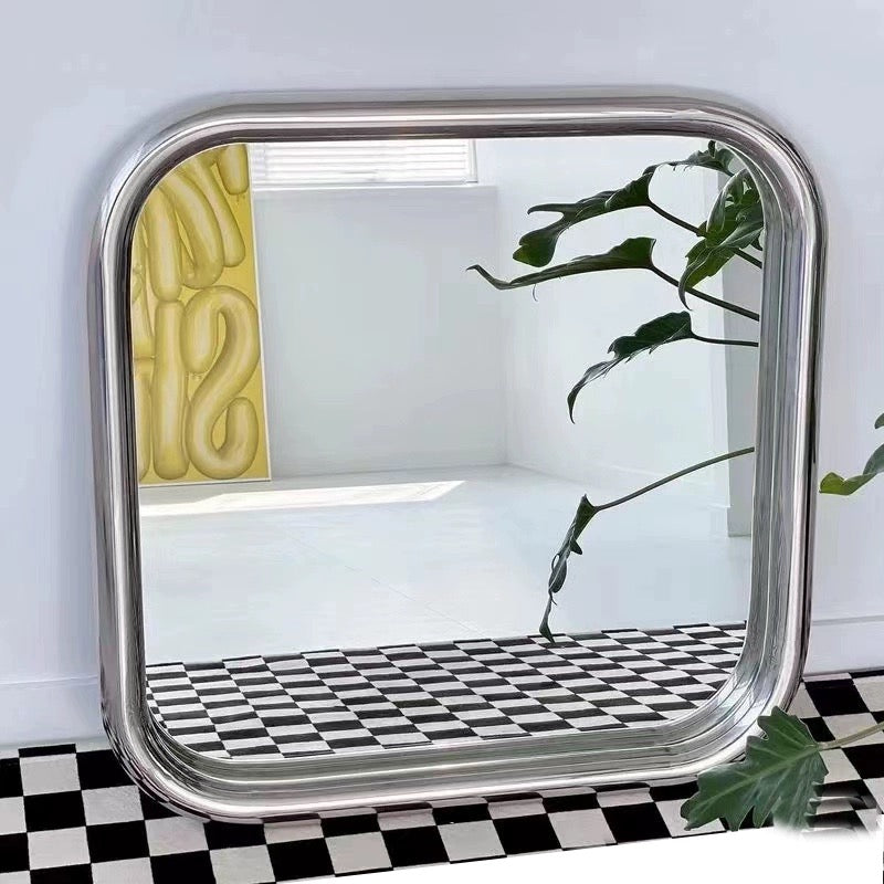 Compact silvery rectangular mirror with modern metal frame. Perfect for wall mounting or desktop use in bathrooms or bedrooms.