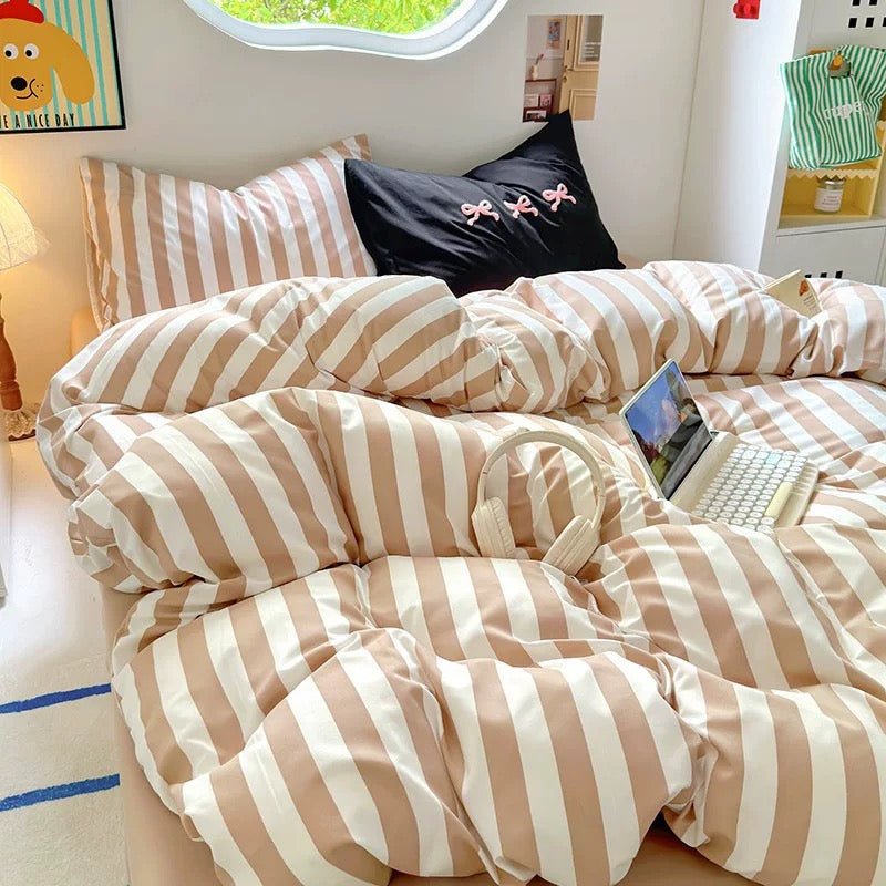 Pinterest-inspired room featuring beige striped comforter.