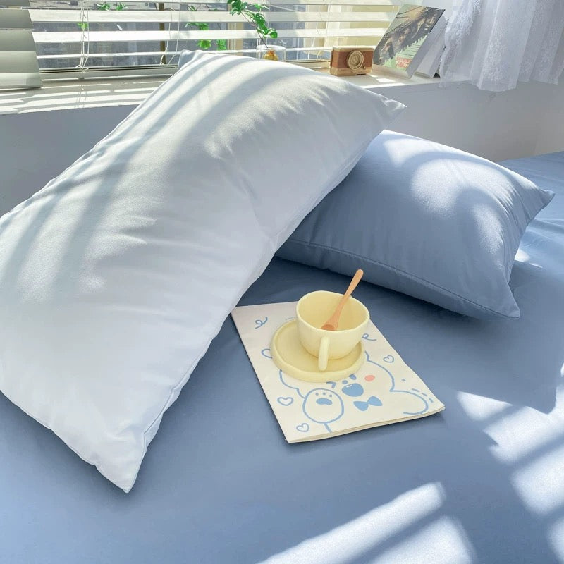 College apartment decor styled with solid blue bedding set.