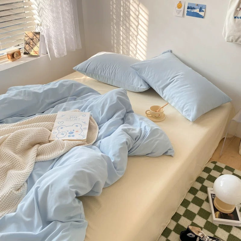 Aesthetic cream and blue bedding for dorm rooms and small bedrooms.