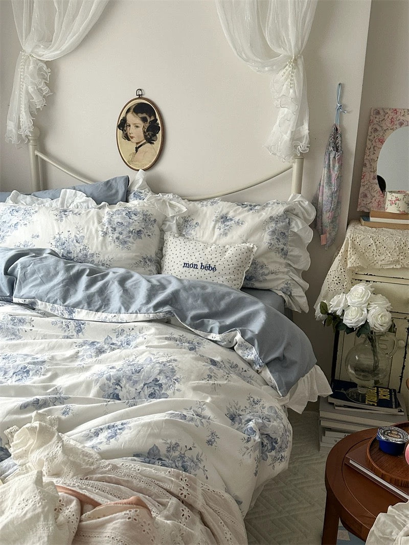 Blue floral lace bedding styled for a cottagecore aesthetic with cozy vibes.