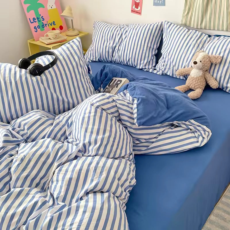 Affordable blue striped bedding set styled as dorm room essential for back-to-school season.