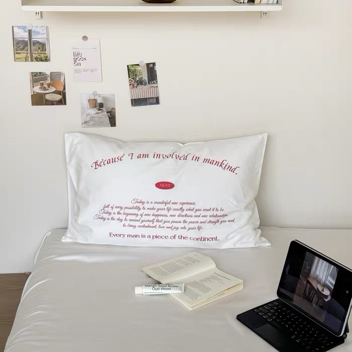 Cherry pillowcase styled in a coquette bedroom with lace curtains and bows.