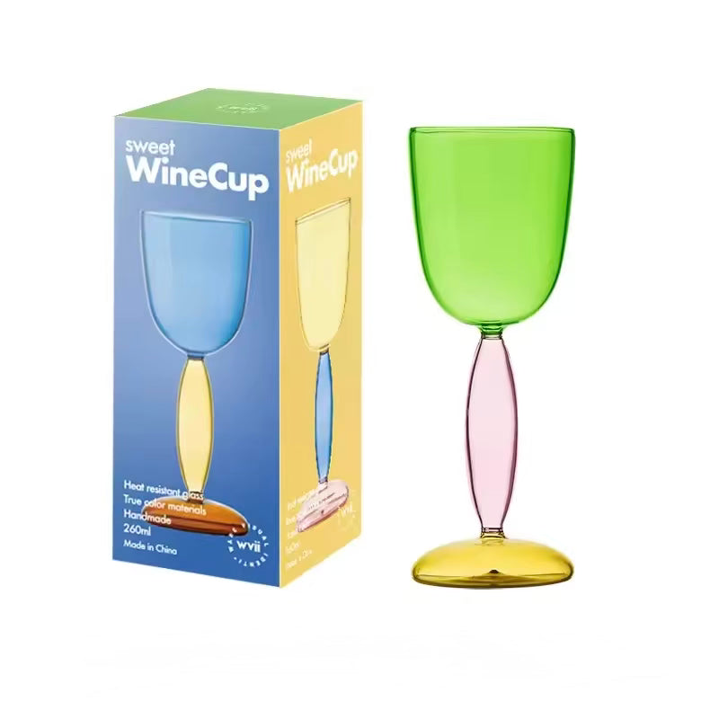 Colorful wine glass with packaging on a white background