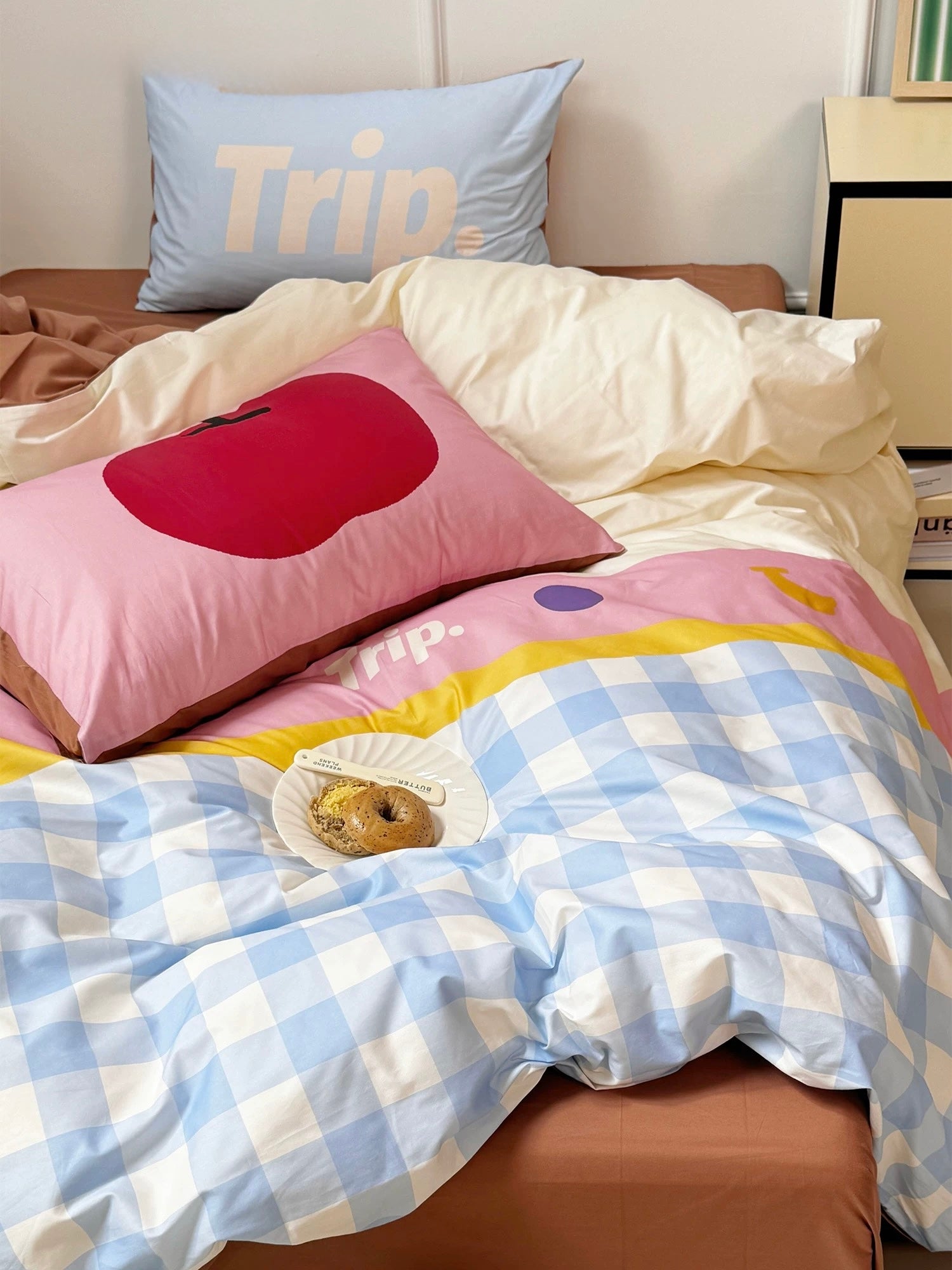 Pastel gingham dopamine quilt cover set styled with kawaii pillows in a dorm room.