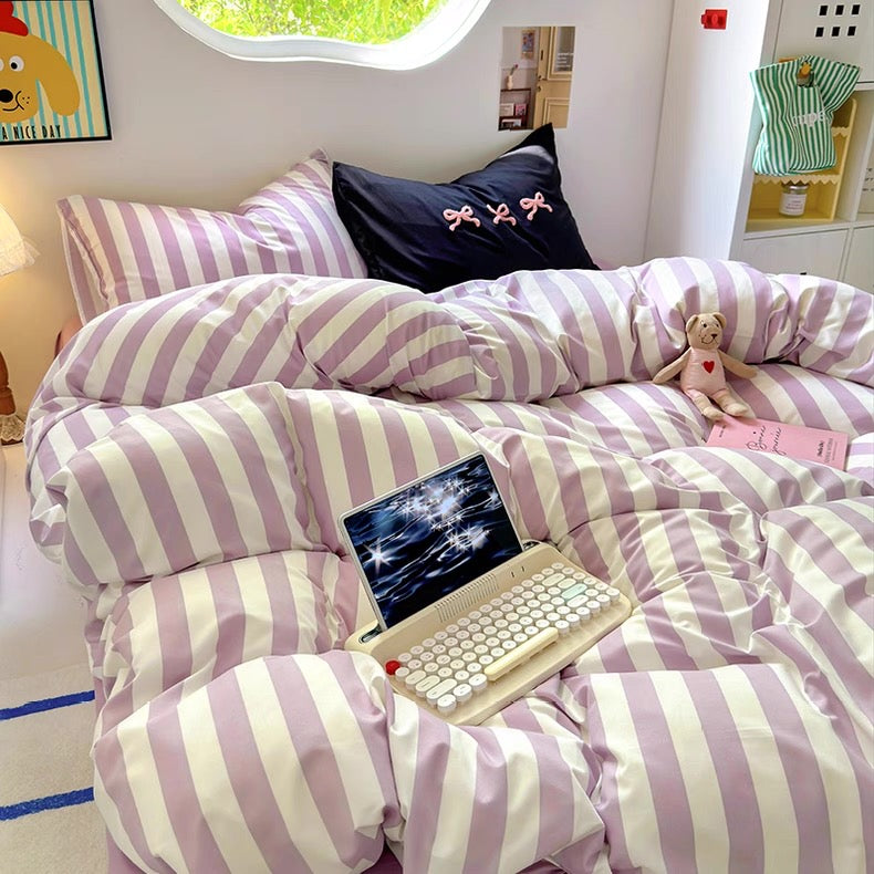 Flat lay of the 4-piece bedding set including duvet cover, flat sheet, and pillowcases