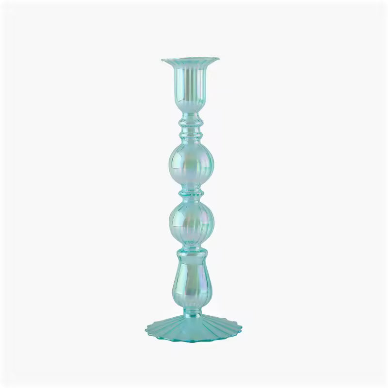 Turquoise glass candle holder on a white background