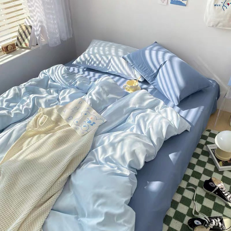 Dorm room decor idea with cozy blue bedding and minimalist vibe.