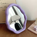 Pastel wavy mirror as trendy room accent for bedroom