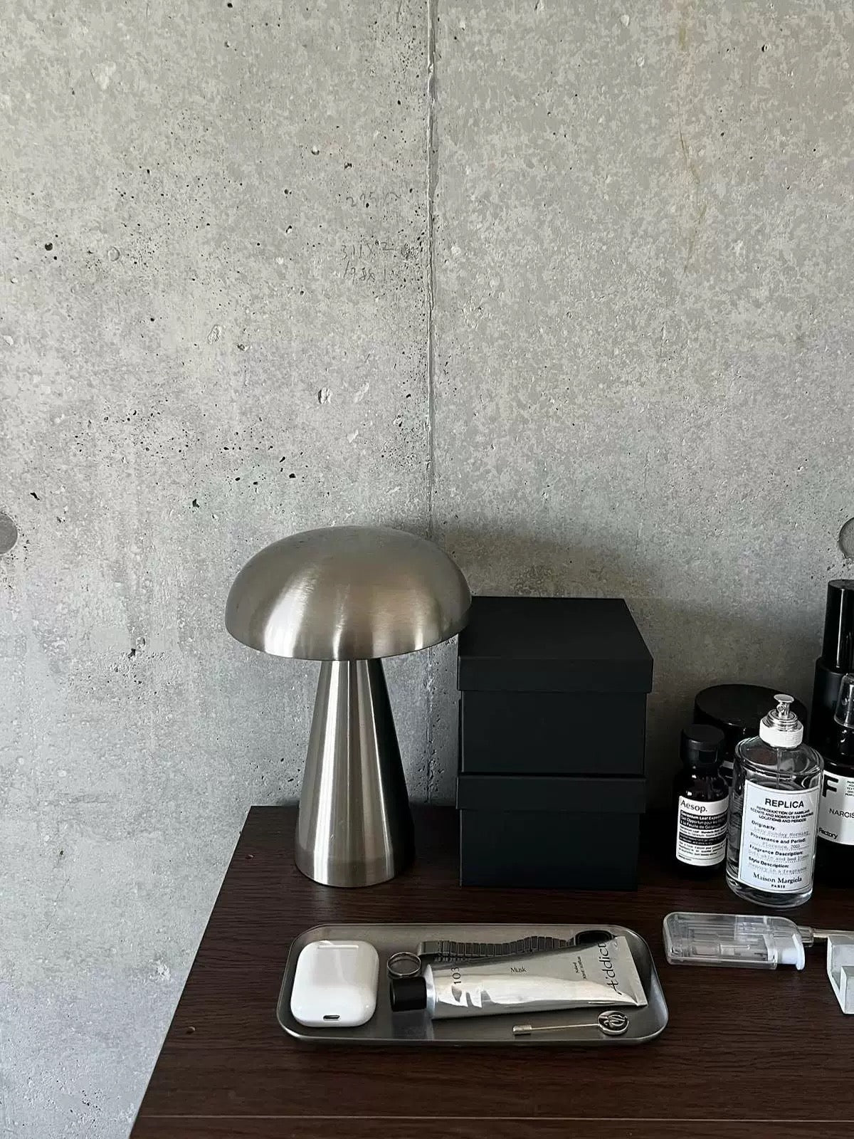 Bronze-colored cordless lamp on modern desk setup