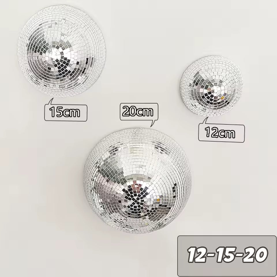 Three disco balls of different sizes with measurements on a white background