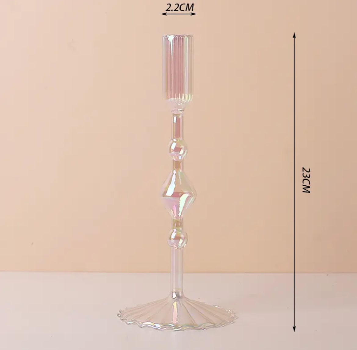 Glass vase styled as a decorative candle holder