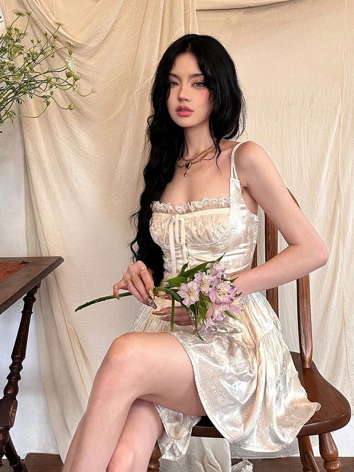 Soft girl aesthetic vintage mini dress with ruffled details and spaghetti straps. Satin A-line dress for summer events and fairycore vibes.
