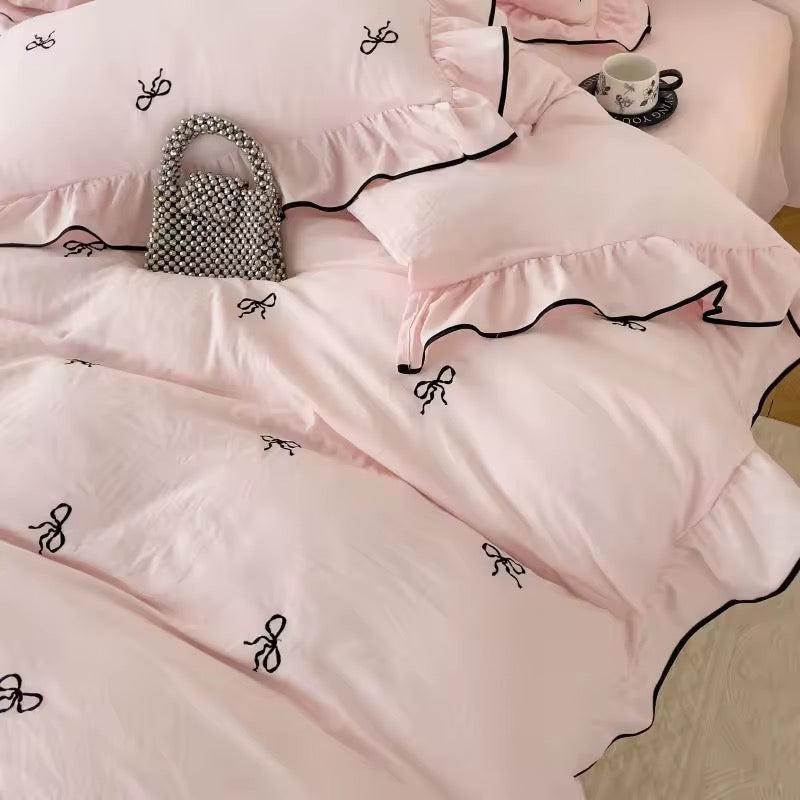 Balletcore-inspired white bedding with elegant bow embroidery