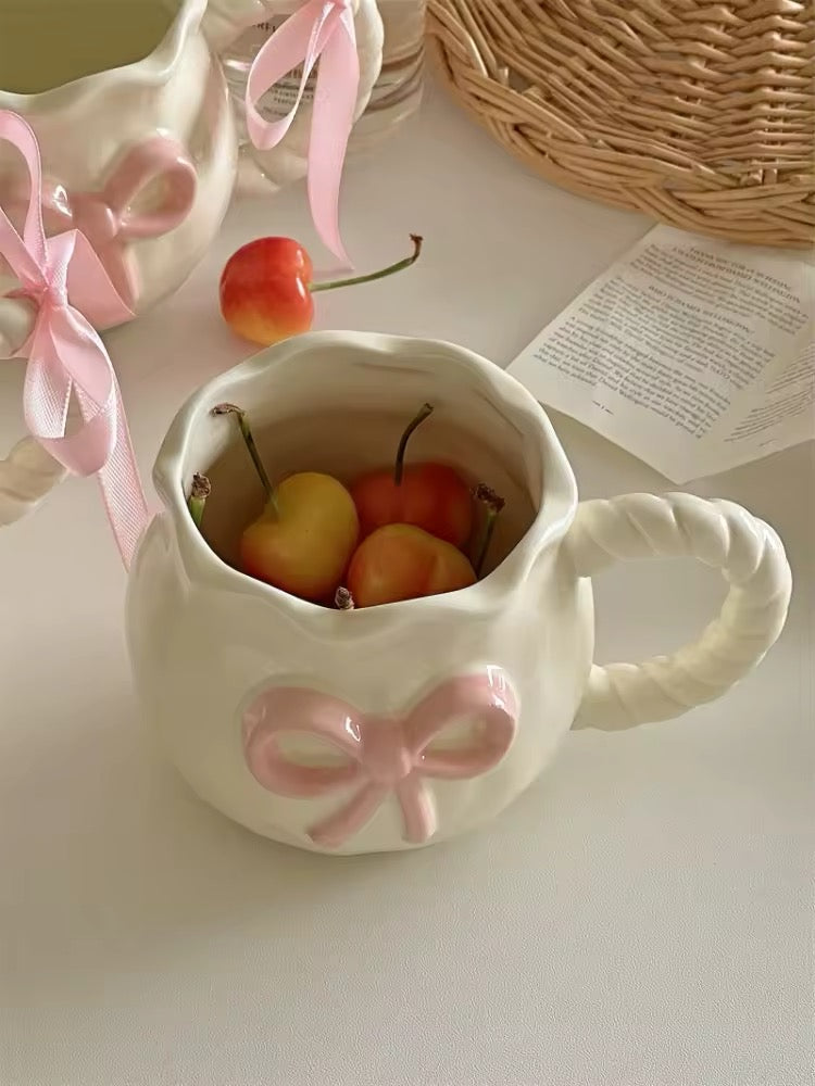Close-up of pastel pink bow on handmade mug