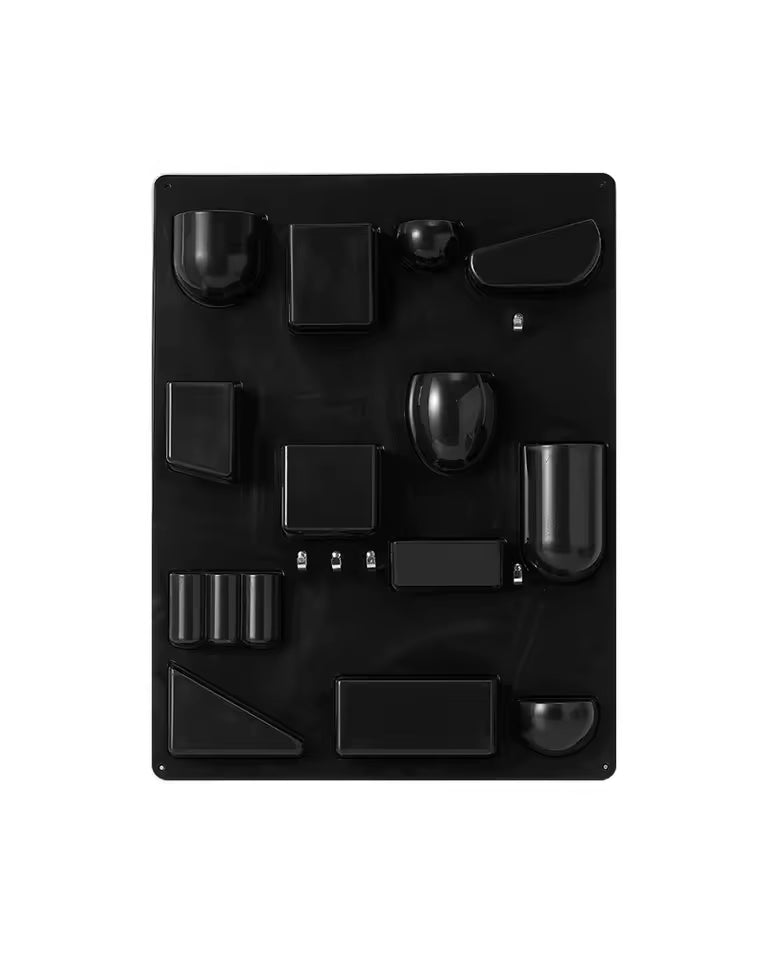 Black textured panel with various geometric shapes on a white background