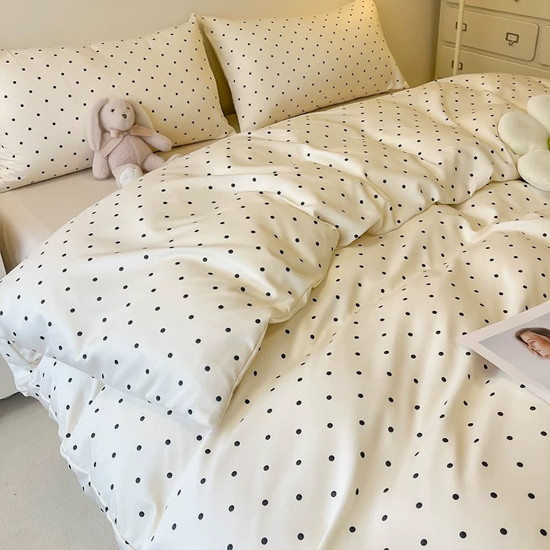 Cooling satin polka dot duvet cover set with chic preppy room decor.