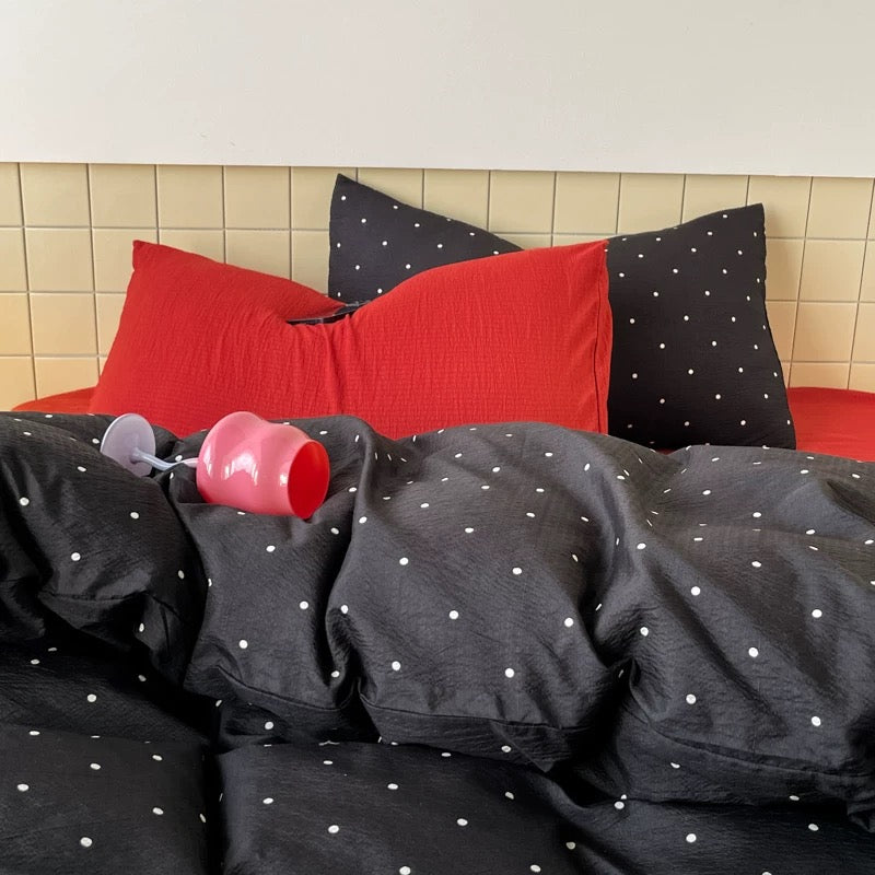 Preppy polka dot bedding set paired with neutral walls for balanced room look modern decor