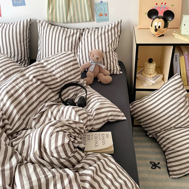 Minimalist black bedding set with striped pattern, perfect for aesthetic bedrooms.