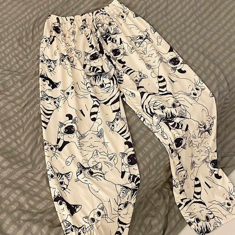 Comfortable women’s pajama pants with a cute cartoon cat print