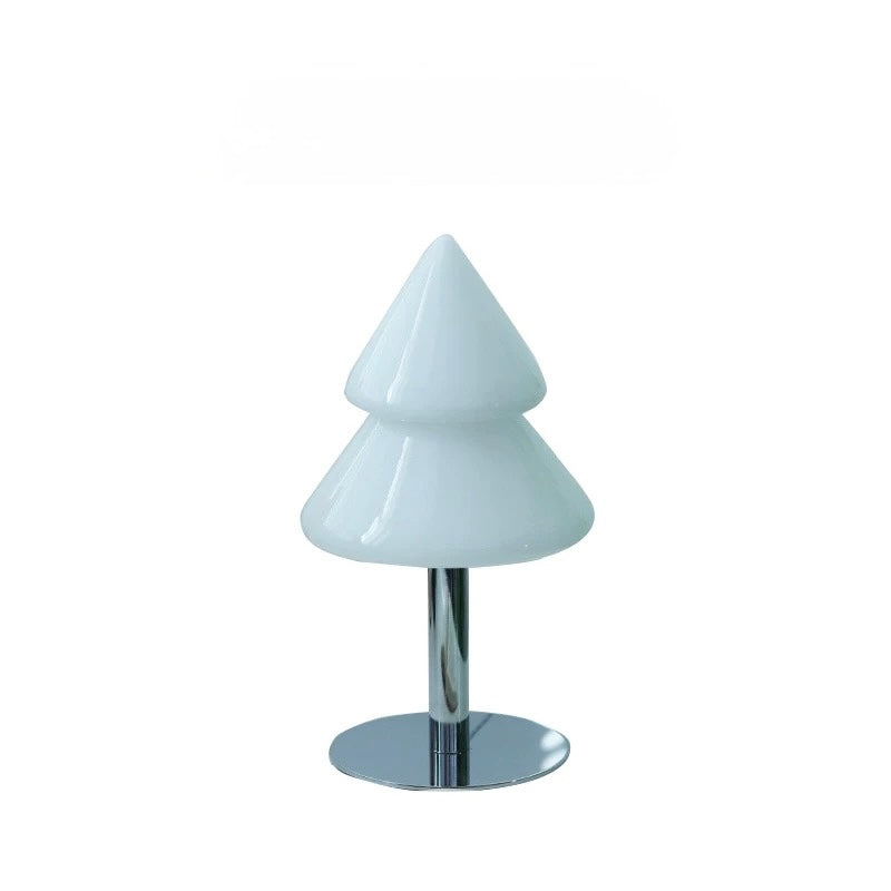 Blue Christmas tree lamp with silver base on a plain background