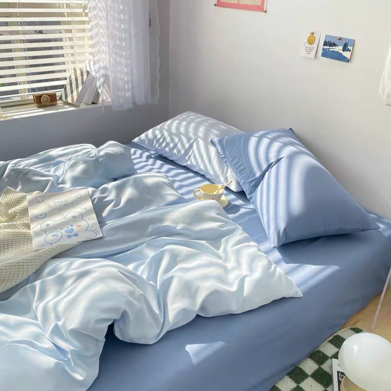 Aesthetic bedding in pastel blue with pillowcases and matching flat sheet.